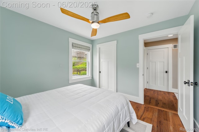 11693 Kenton Dr, Whitmore Lake, MI 48189 - bedroom featuring wood finished floors and a ceiling fan