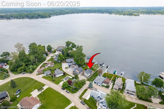 11693 Kenton Dr, Whitmore Lake, MI 48189 - aerial view of property's location with a nearby body of water and nearby suburban area