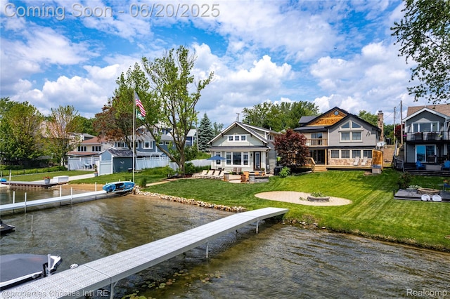 11693 Kenton Dr, Whitmore Lake, MI 48189 - dock area featuring a fire pit, a lawn, a deck with water view, and a residential view