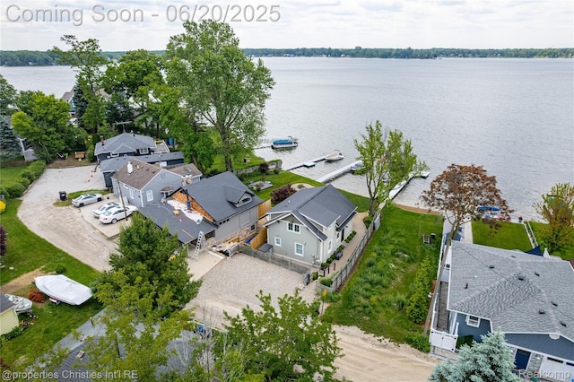 11693 Kenton Dr, Whitmore Lake, MI 48189 - aerial perspective of suburban area with a nearby body of water