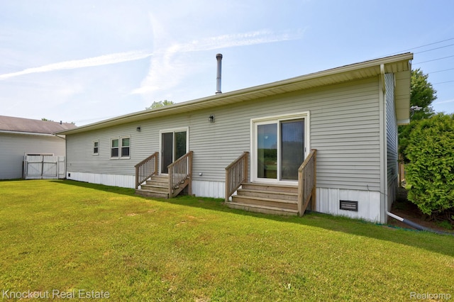 5490 Rupprecht Rd, Vassar, MI 48768 - rear view of property featuring entry steps and a lawn