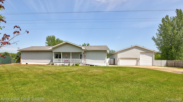 5490 Rupprecht Rd, Vassar, MI 48768 - view of front facade featuring covered porch, a detached garage, and an outbuilding