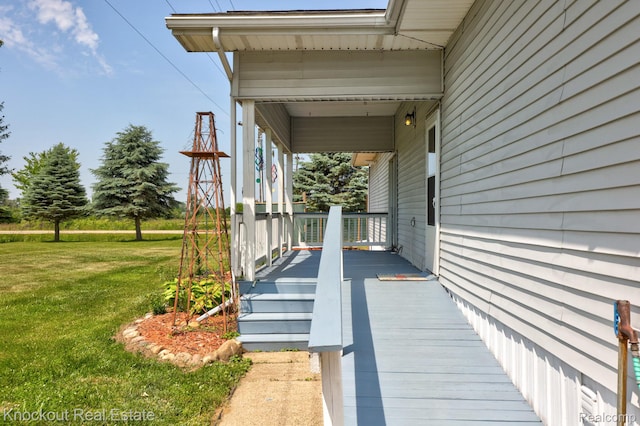 5490 Rupprecht Rd, Vassar, MI 48768 - porch featuring a yard