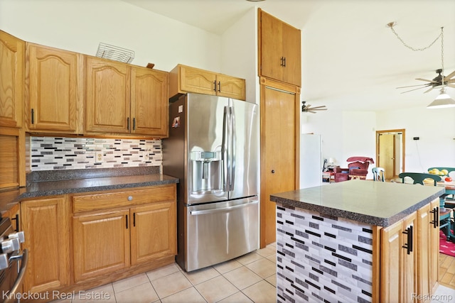 5490 Rupprecht Rd, Vassar, MI 48768 - kitchen featuring stainless steel refrigerator with ice dispenser, a ceiling fan, decorative backsplash, and dark countertops