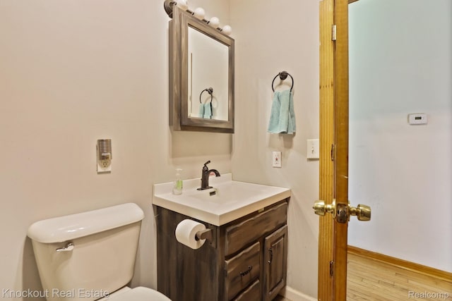 5490 Rupprecht Rd, Vassar, MI 48768 - bathroom with vanity and wood finished floors