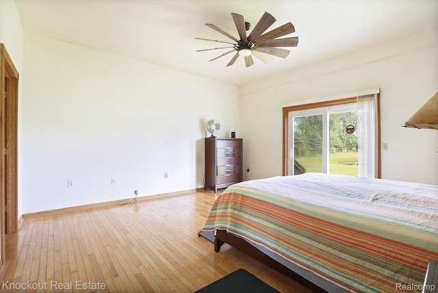 5490 Rupprecht Rd, Vassar, MI 48768 - bedroom featuring light wood-style floors, access to exterior, and a ceiling fan