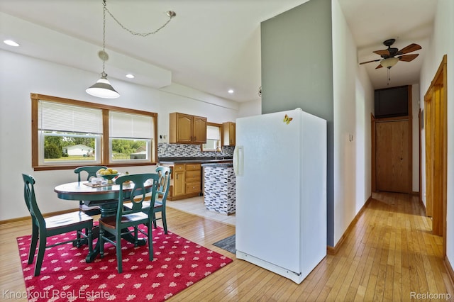 5490 Rupprecht Rd, Vassar, MI 48768 - dining space featuring light wood-style flooring, a ceiling fan, and recessed lighting