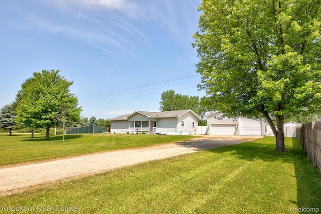 5490 Rupprecht Rd, Vassar, MI 48768 - view of front facade with dirt driveway and an outbuilding