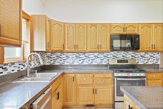 5490 Rupprecht Rd, Vassar, MI 48768 - kitchen with black microwave, stainless steel range with gas stovetop, white dishwasher, and backsplash