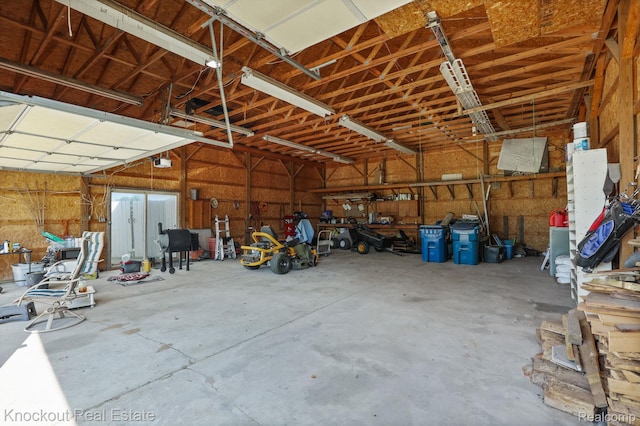 5490 Rupprecht Rd, Vassar, MI 48768 - garage featuring a garage door opener