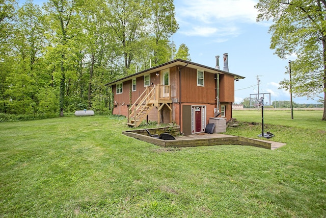 7920 8 1/2 Mile Rd, Ceresco, MI 49033 - rear view of property with a lawn, a chimney, and stairway