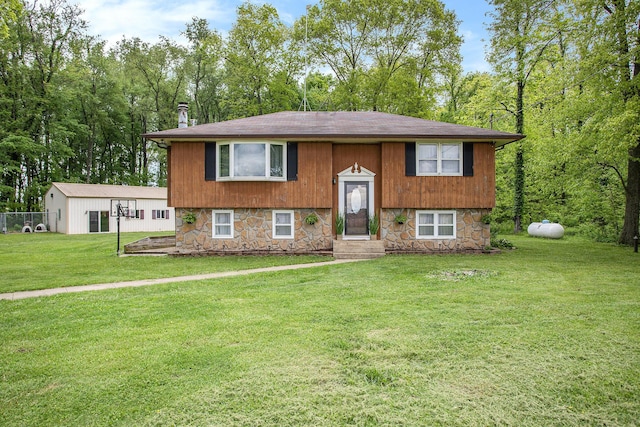 7920 8 1/2 Mile Rd, Ceresco, MI 49033 - bi-level home featuring stone siding, roof with shingles, and entry steps