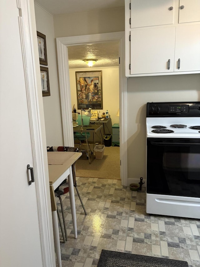 2065 Reggie Dr, Benton Harbor, MI 49022 - kitchen with white range with electric stovetop, white cabinetry, and light floors