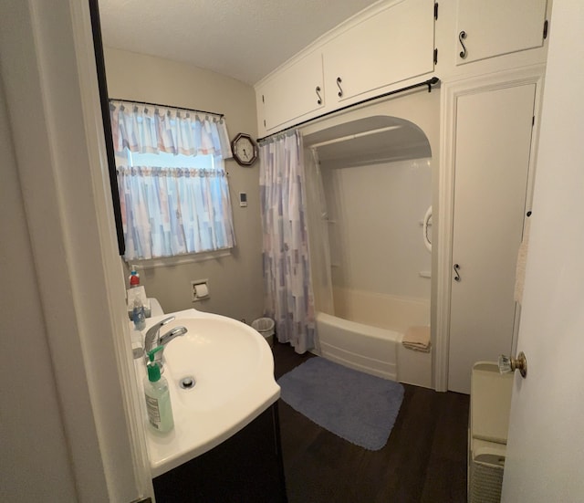 2065 Reggie Dr, Benton Harbor, MI 49022 - full bathroom featuring vanity, shower / bath combo with shower curtain, and wood finished floors
