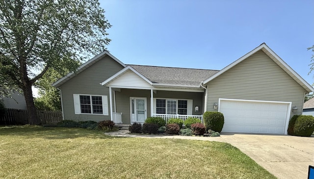 5798 Wacker Dr, Stevensville, MI 49127 - view of front of home with concrete driveway, a porch, a garage, and a shingled roof