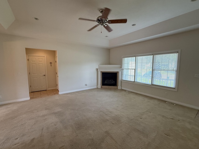 5798 Wacker Dr, Stevensville, MI 49127 - unfurnished living room featuring light carpet, ceiling fan, and a fireplace