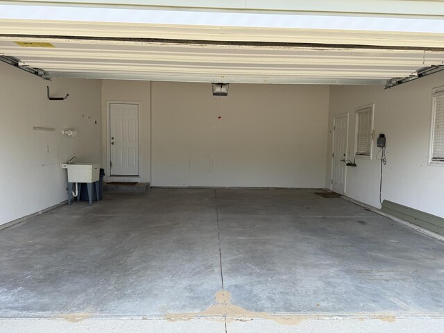 5798 Wacker Dr, Stevensville, MI 49127 - garage with a garage door opener and a sink