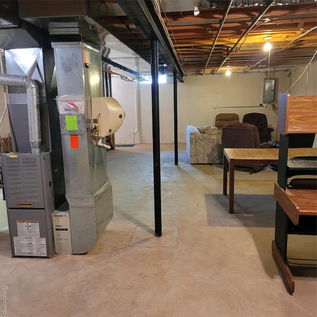 22865 Woodcreek Dr, Taylor, MI 48180 - unfinished basement featuring electric panel and heating unit