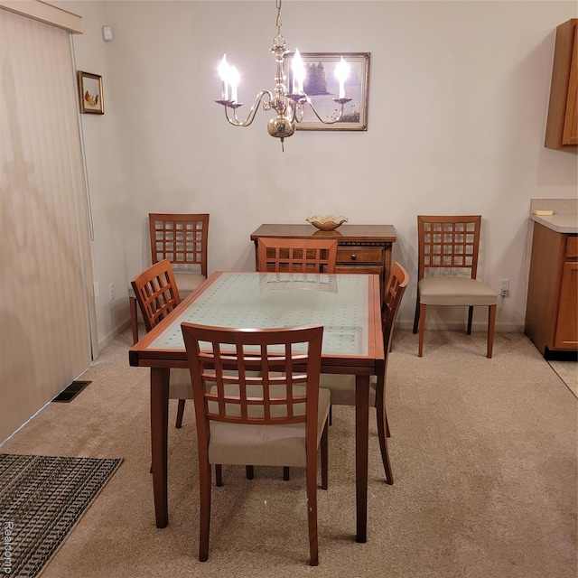22865 Woodcreek Dr, Taylor, MI 48180 - dining room featuring light carpet and a chandelier