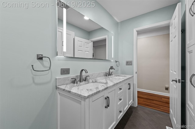 49775 Keycove St, Chesterfield, MI 48047 - full bathroom featuring double vanity and wood finished floors