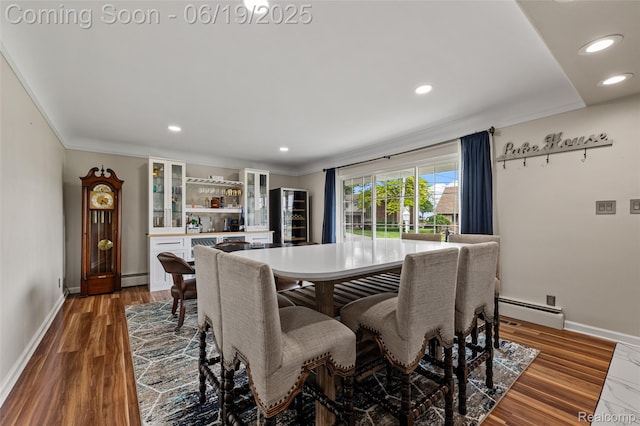 49775 Keycove St, Chesterfield, MI 48047 - dining space featuring baseboard heating, ornamental molding, a dry bar, recessed lighting, and wood finished floors
