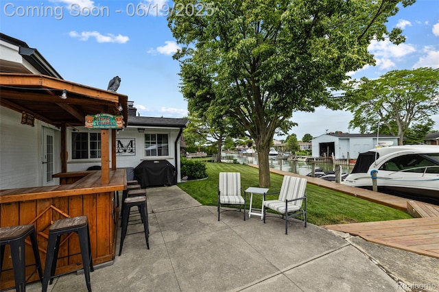 49775 Keycove St, Chesterfield, MI 48047 - view of patio featuring a grill and a water view
