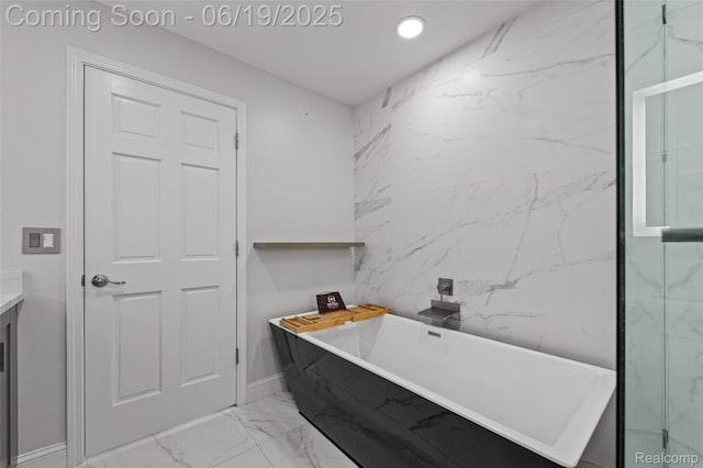49775 Keycove St, Chesterfield, MI 48047 - bathroom featuring marble look tile flooring, a soaking tub, vanity, and recessed lighting