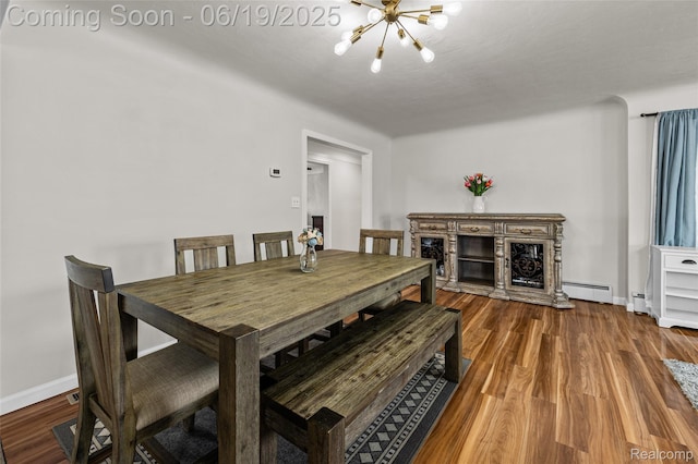 49775 Keycove St, Chesterfield, MI 48047 - dining room with a chandelier, a baseboard radiator, wood finished floors, and a baseboard heating unit