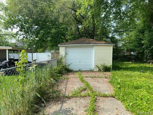 19670 Mccormick St, Detroit, MI 48224 - detached garage featuring concrete driveway