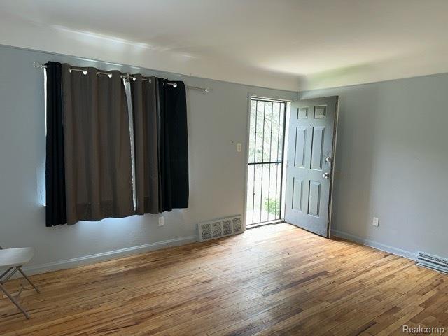 19670 Mccormick St, Detroit, MI 48224 - unfurnished room with wood finished floors and baseboards