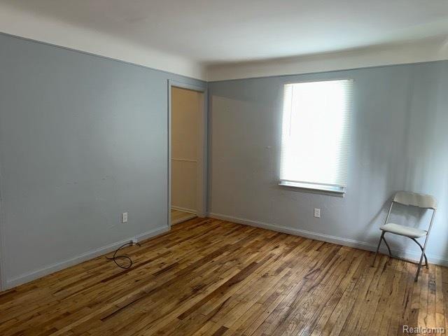 19670 Mccormick St, Detroit, MI 48224 - unfurnished room with hardwood / wood-style floors and baseboards