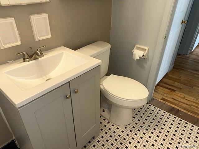 19670 Mccormick St, Detroit, MI 48224 - half bathroom with toilet and vanity