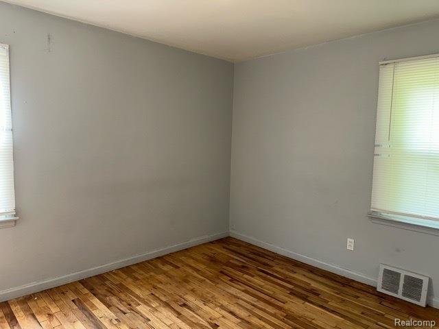 19670 Mccormick St, Detroit, MI 48224 - unfurnished room with light wood finished floors and plenty of natural light