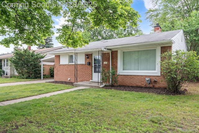 339 Shotka St, Westland, MI 48186 - view of front of home featuring brick siding, a front lawn, a chimney, and driveway