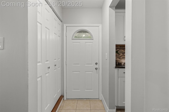 339 Shotka St, Westland, MI 48186 - doorway to outside with light tile patterned floors and baseboards