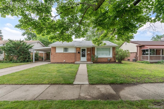 339 Shotka St, Westland, MI 48186 - view of front of property featuring brick siding, a front yard, driveway, roof with shingles, and an attached carport