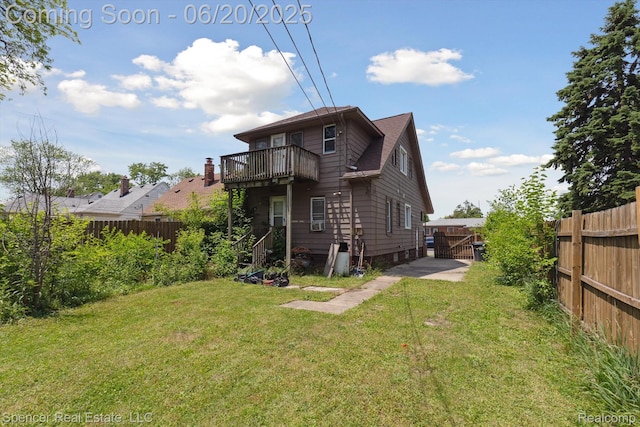 17398 Hanna St, Melvindale, MI 48122 - back of house with a fenced backyard, a balcony, and a gate