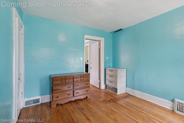 17398 Hanna St, Melvindale, MI 48122 - unfurnished bedroom with wood finished floors and baseboards