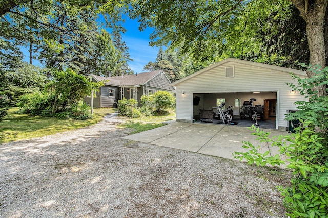701 E Alice St, Whitehall, MI 49461 - view of front of property featuring an outdoor structure and a garage