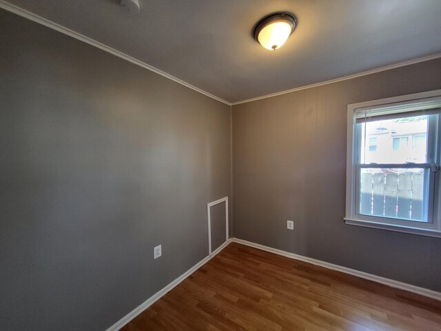 23077 Piper Ave, Eastpointe, MI 48021 - unfurnished room featuring wood finished floors and crown molding