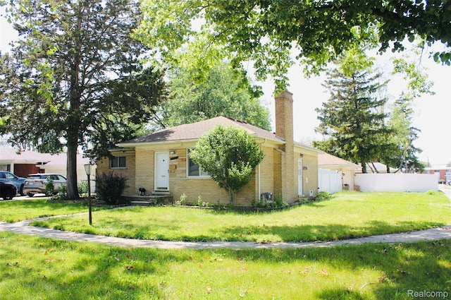 29150 Geraldine Ct, Warren, MI 48093 - view of front of property featuring a chimney and brick siding