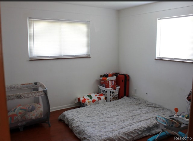 29150 Geraldine Ct, Warren, MI 48093 - bedroom with multiple windows and wood finished floors