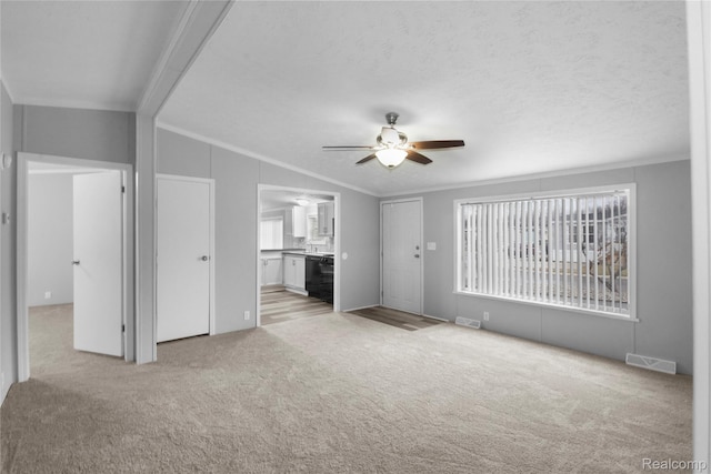 39500 W Warren Rd, Canton, MI 48187 - unfurnished living room featuring ornamental molding, light colored carpet, and ceiling fan