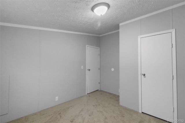 39500 W Warren Rd, Canton, MI 48187 - unfurnished bedroom featuring a textured ceiling, carpet flooring, and crown molding