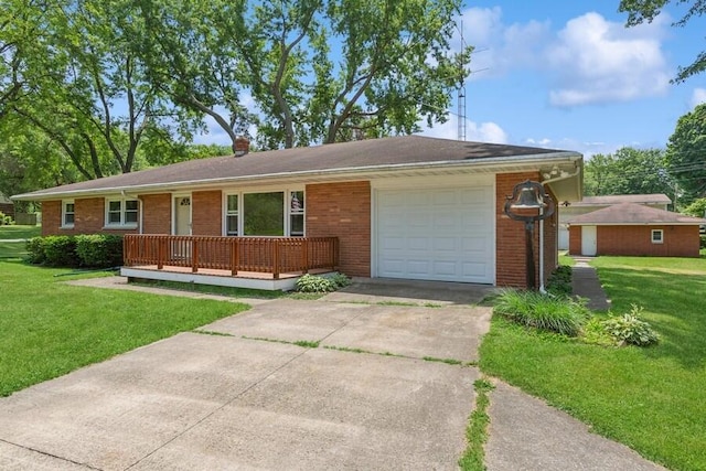 3202 Niles Buchanan Rd, Buchanan, MI 49107 - ranch-style home with a garage, a front yard, driveway, and brick siding