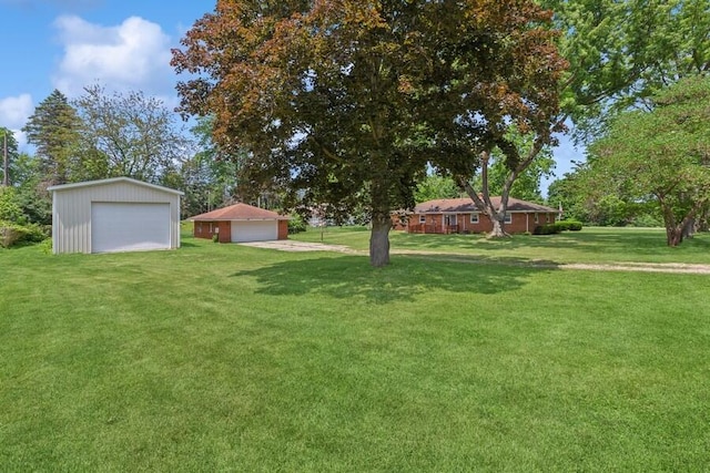 3202 Niles Buchanan Rd, Buchanan, MI 49107 - view of grassy yard featuring a detached garage and an outdoor structure