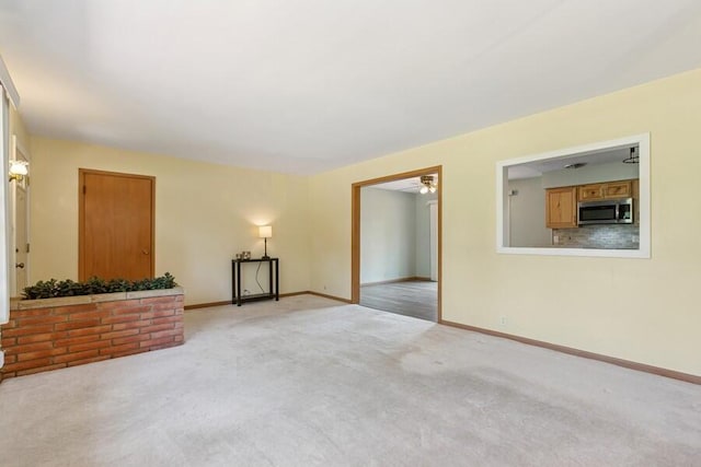 3202 Niles Buchanan Rd, Buchanan, MI 49107 - unfurnished room featuring ceiling fan and light carpet
