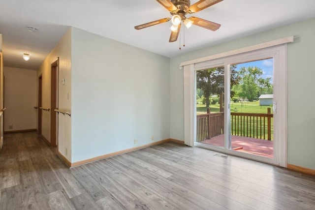 3202 Niles Buchanan Rd, Buchanan, MI 49107 - spare room with wood finished floors, a ceiling fan, and a smoke detector