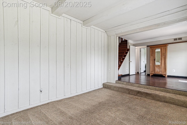 49212 Kimberly Ann Ln, Chesterfield, MI 48051 - unfurnished living room with stairway, carpet, wood walls, and beam ceiling