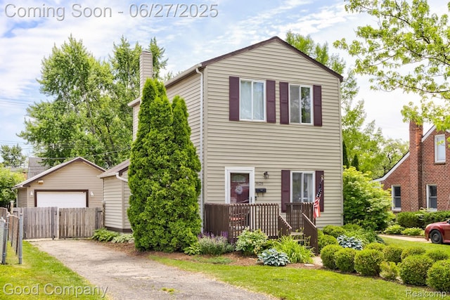 3626 Prairie Ave, Berkley, MI 48072 - view of front of property featuring an outbuilding, a detached garage, and a chimney
